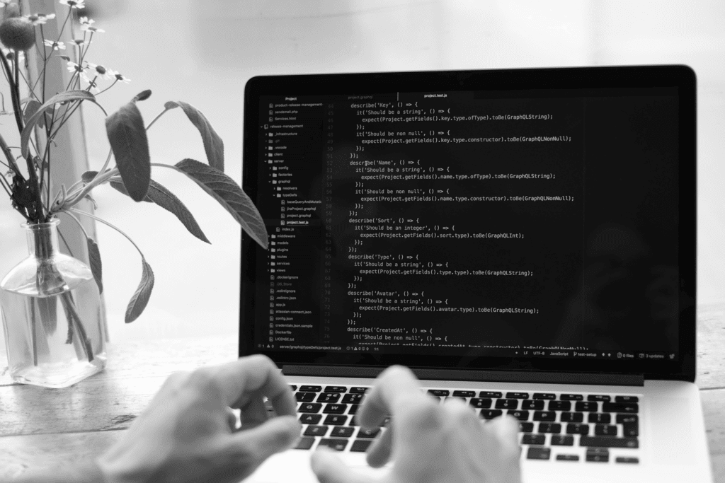 computer with code on the screen representing development services