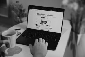 person on laptop representing what makes a good small business website