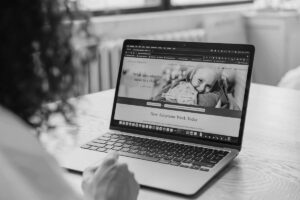 lady visiting website on laptop representing affordable web design vs cheap websites